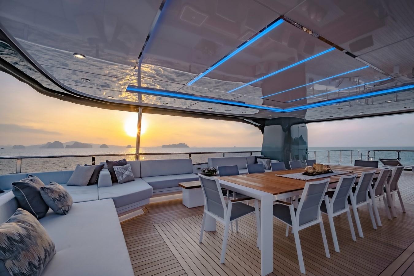 a room with a couch and a table and chairs aboard SONG OF SONGS Yacht for Sale