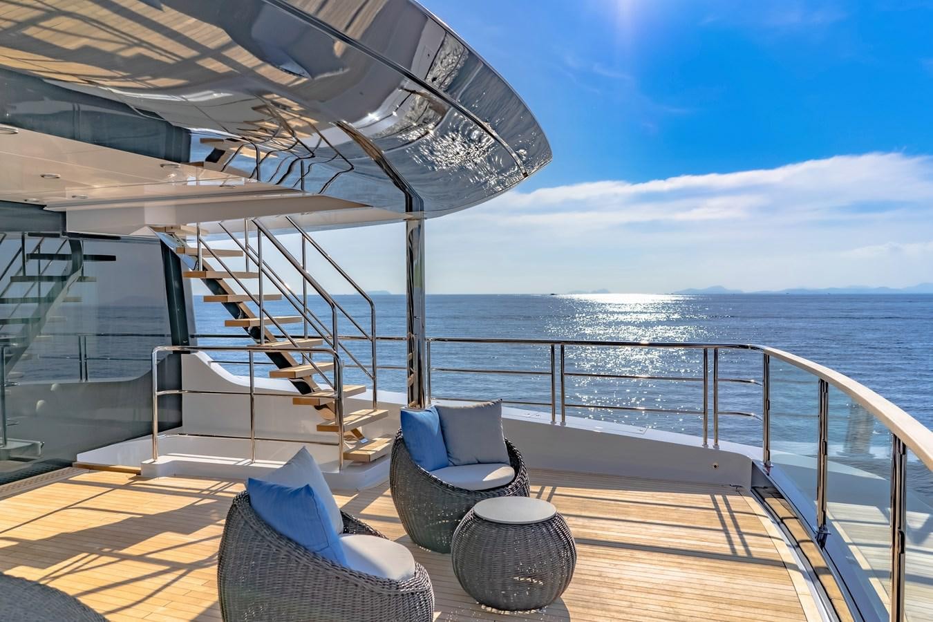 a deck with chairs and a large body of water aboard SONG OF SONGS Yacht for Sale
