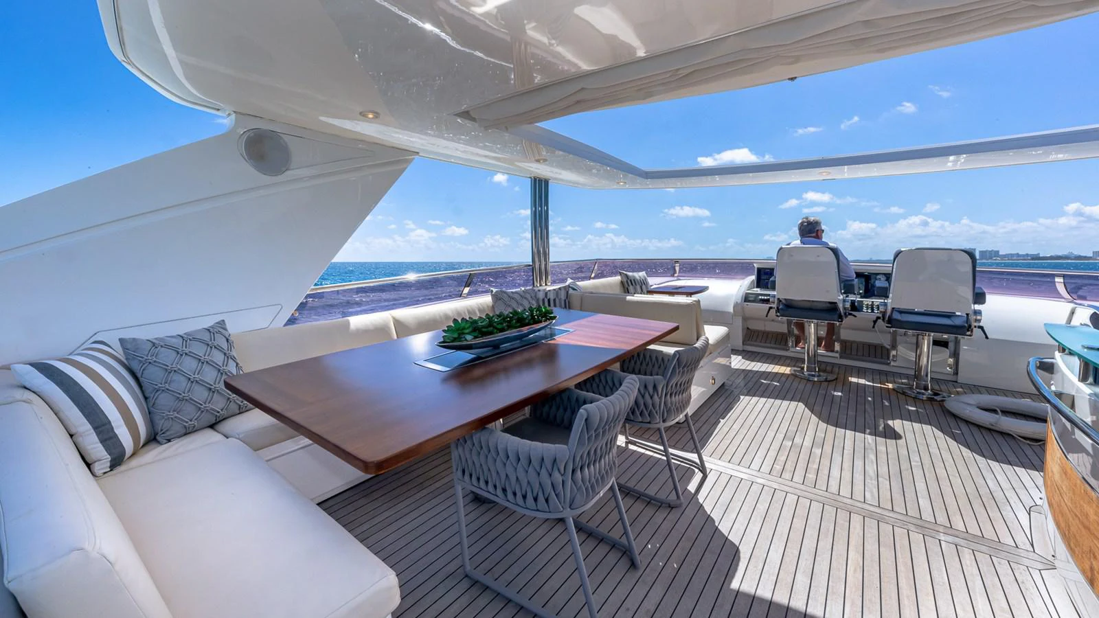 a large white boat with a table and chairs on it aboard LADY COPE Yacht for Sale