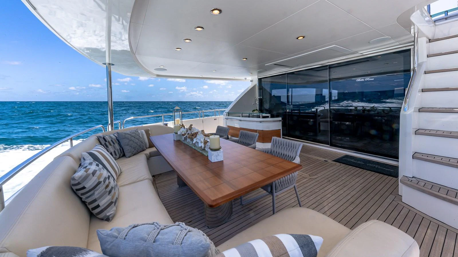 a large living room with a large balcony overlooking the ocean aboard LADY COPE Yacht for Sale