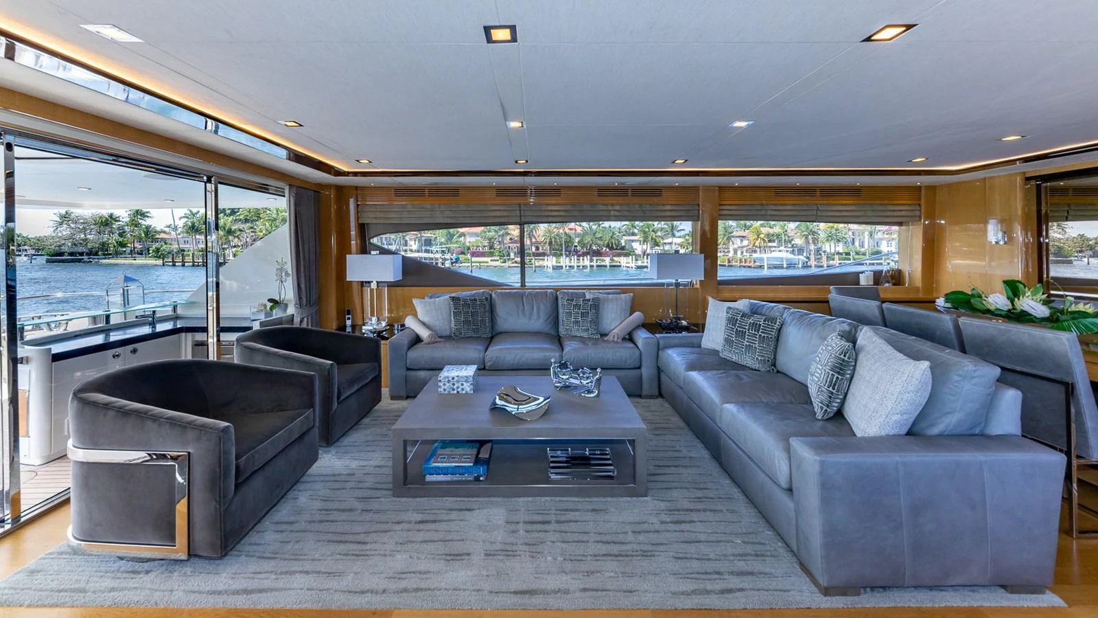a living room with couches and a table aboard LADY COPE Yacht for Sale