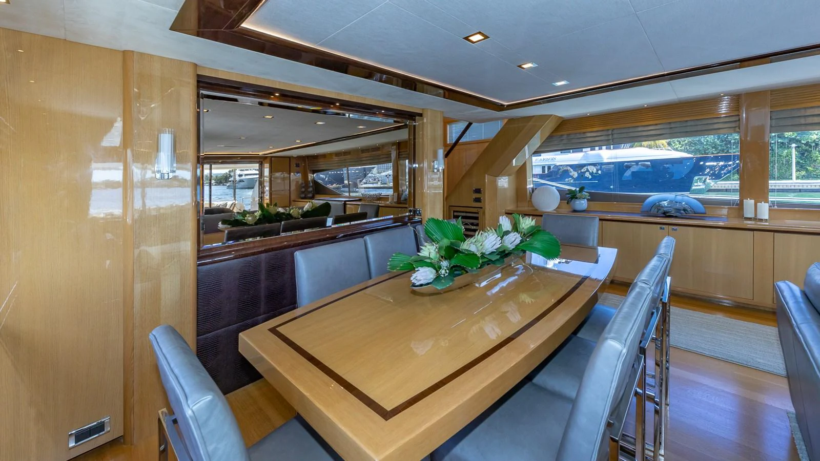 a kitchen with a table and chairs aboard LADY COPE Yacht for Sale
