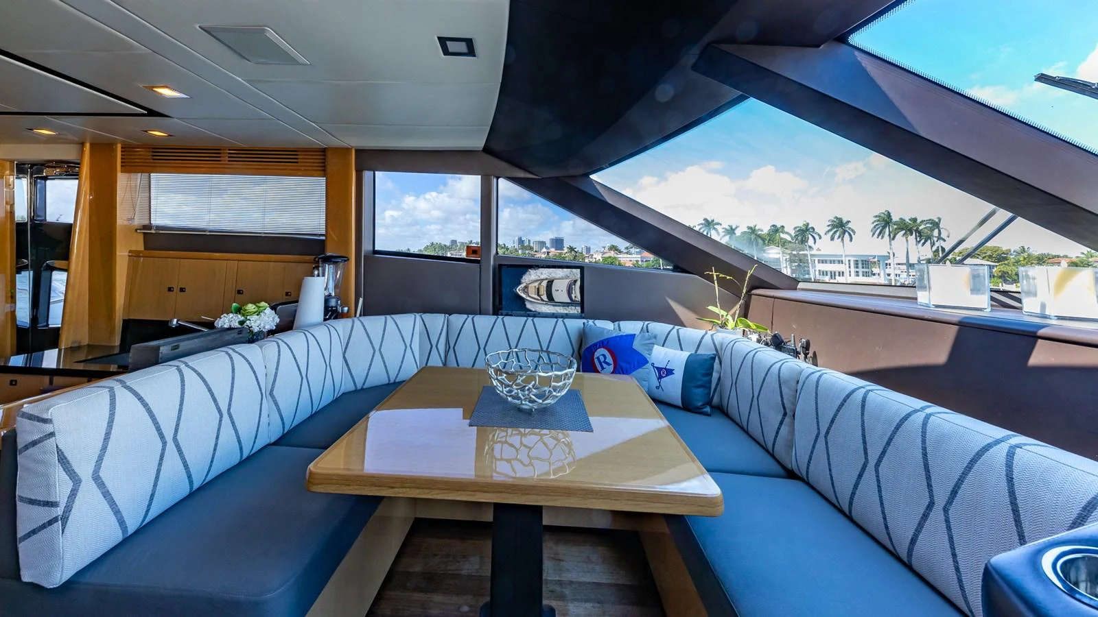 a large living room with a table and chairs aboard LADY COPE Yacht for Sale