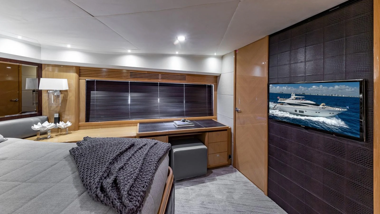 a room with a bed and a tv on the wall aboard LADY COPE Yacht for Sale