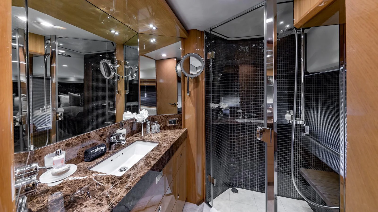 a bathroom with a countertop sink and a large mirror aboard LADY COPE Yacht for Sale