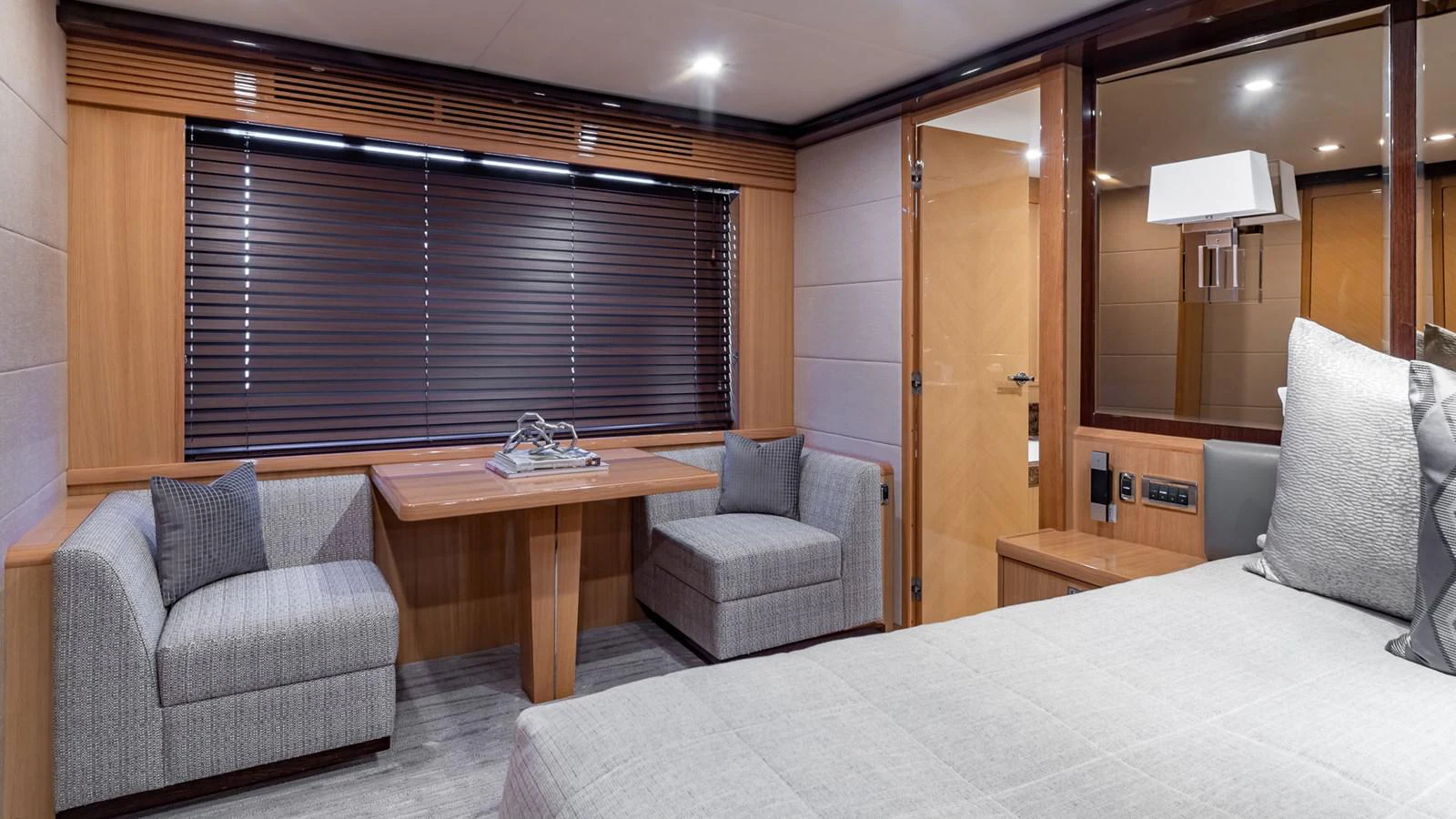 a hotel room with a bed and a desk aboard LADY COPE Yacht for Sale