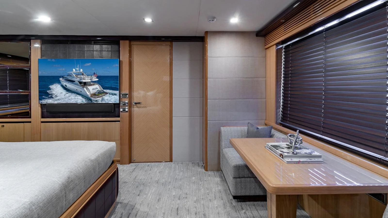 a room with a bed and a desk aboard LADY COPE Yacht for Sale
