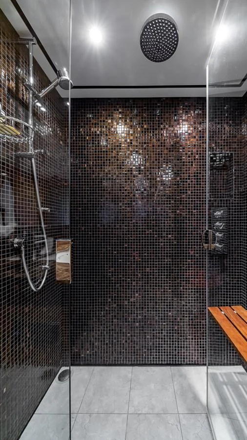 a shower with a tile floor aboard LADY COPE Yacht for Sale