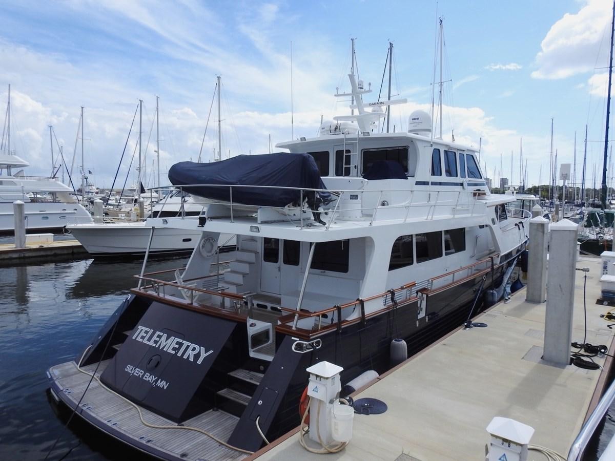 a boat docked at a pier aboard TELEMETRY Yacht for Sale