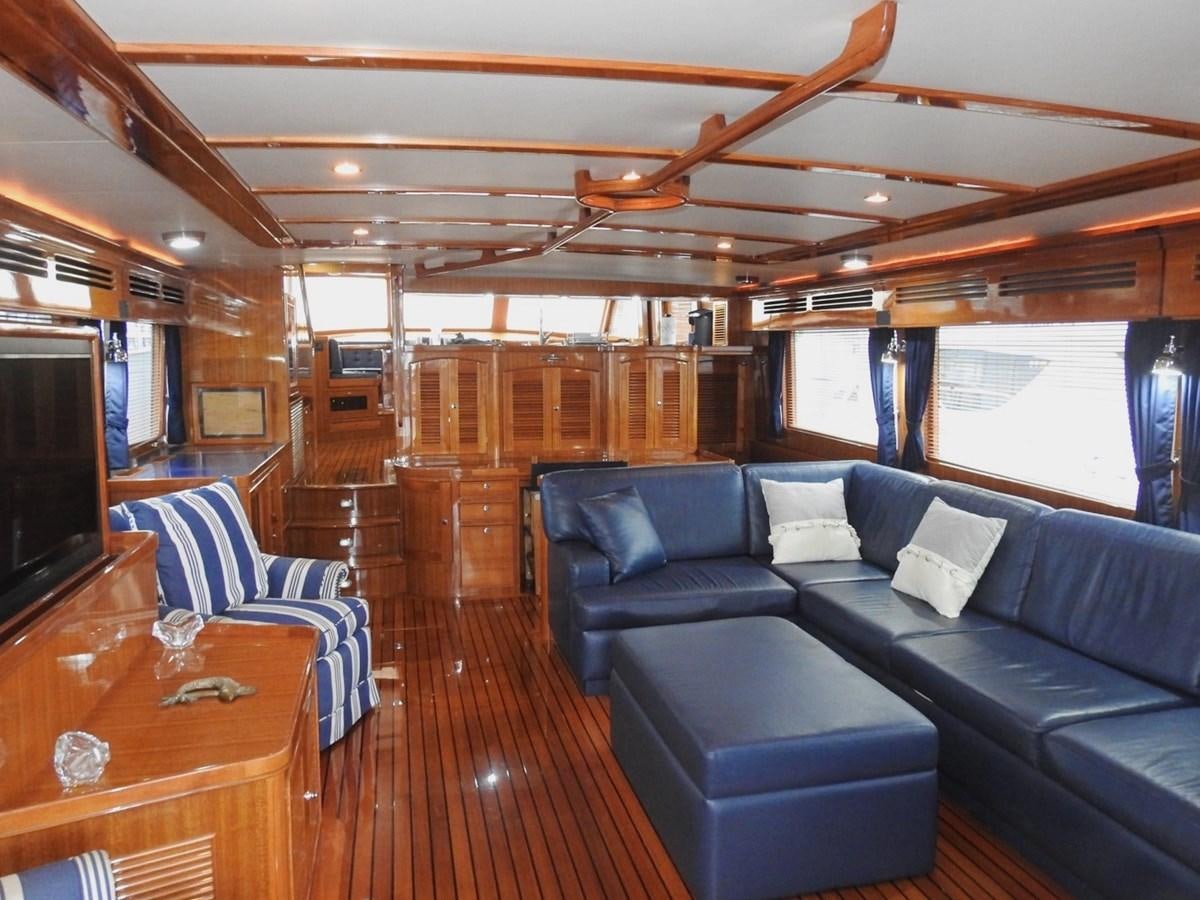 a living room with a wood floor aboard TELEMETRY Yacht for Sale