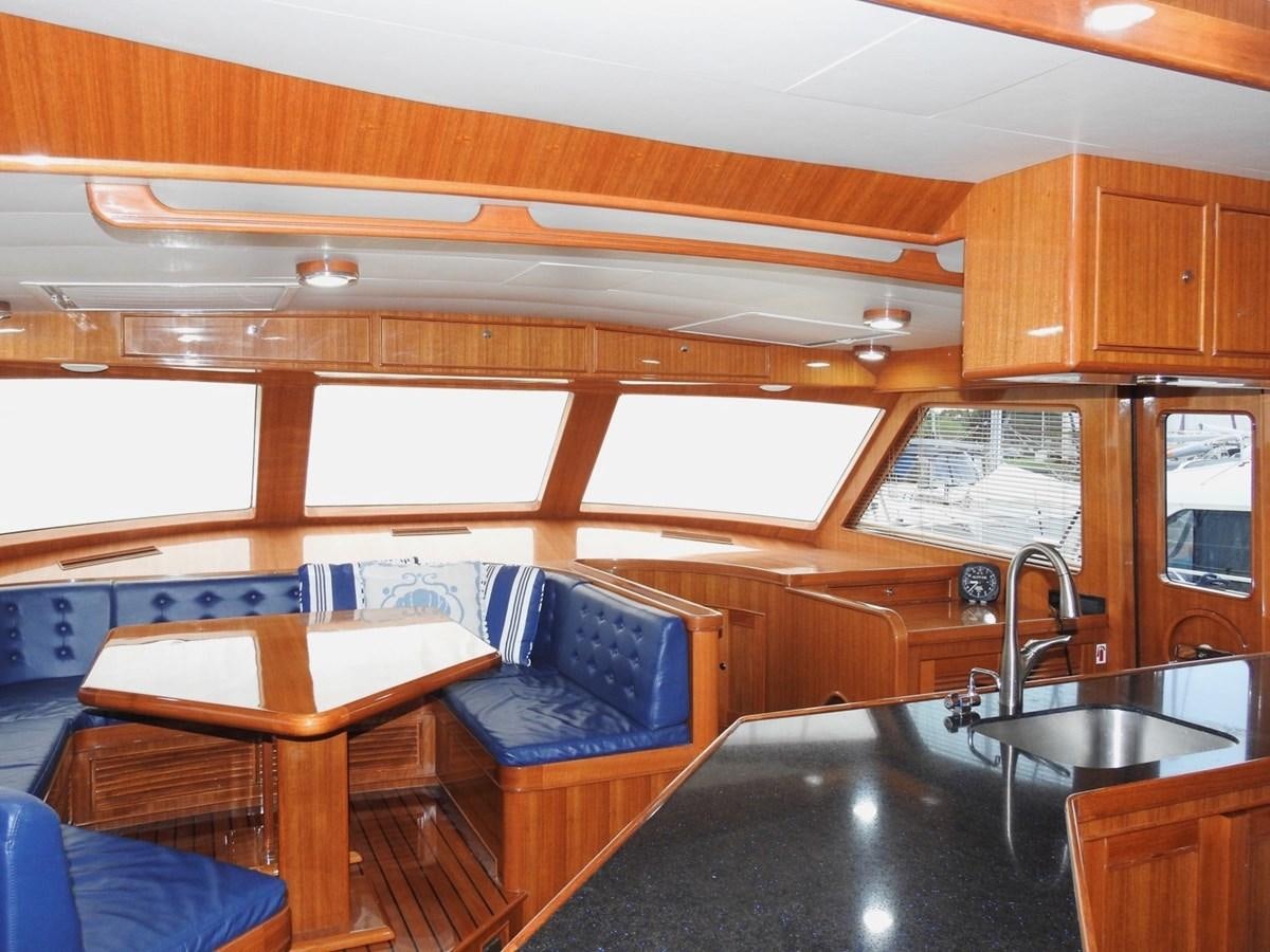 a kitchen with wooden cabinets aboard TELEMETRY Yacht for Sale