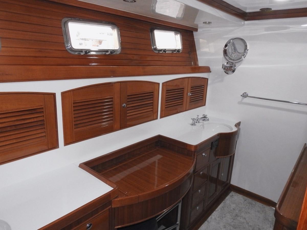 a wooden desk with a chair aboard TELEMETRY Yacht for Sale