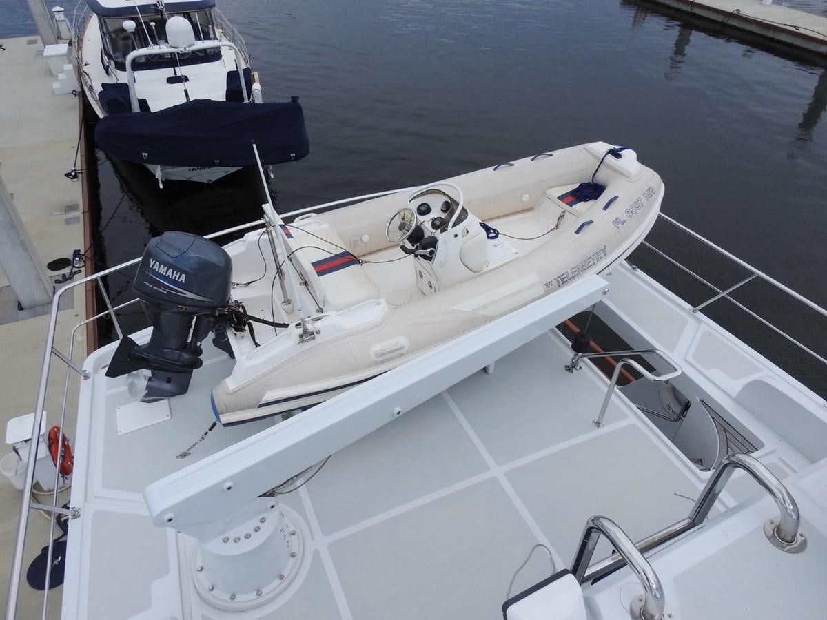 a boat with a motor aboard TELEMETRY Yacht for Sale