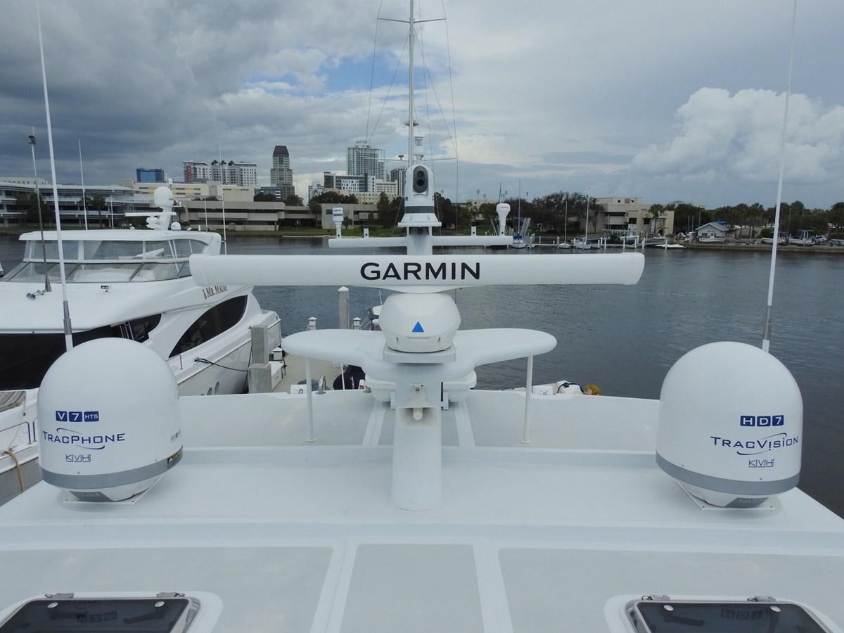 a group of white boats on a dock aboard TELEMETRY Yacht for Sale
