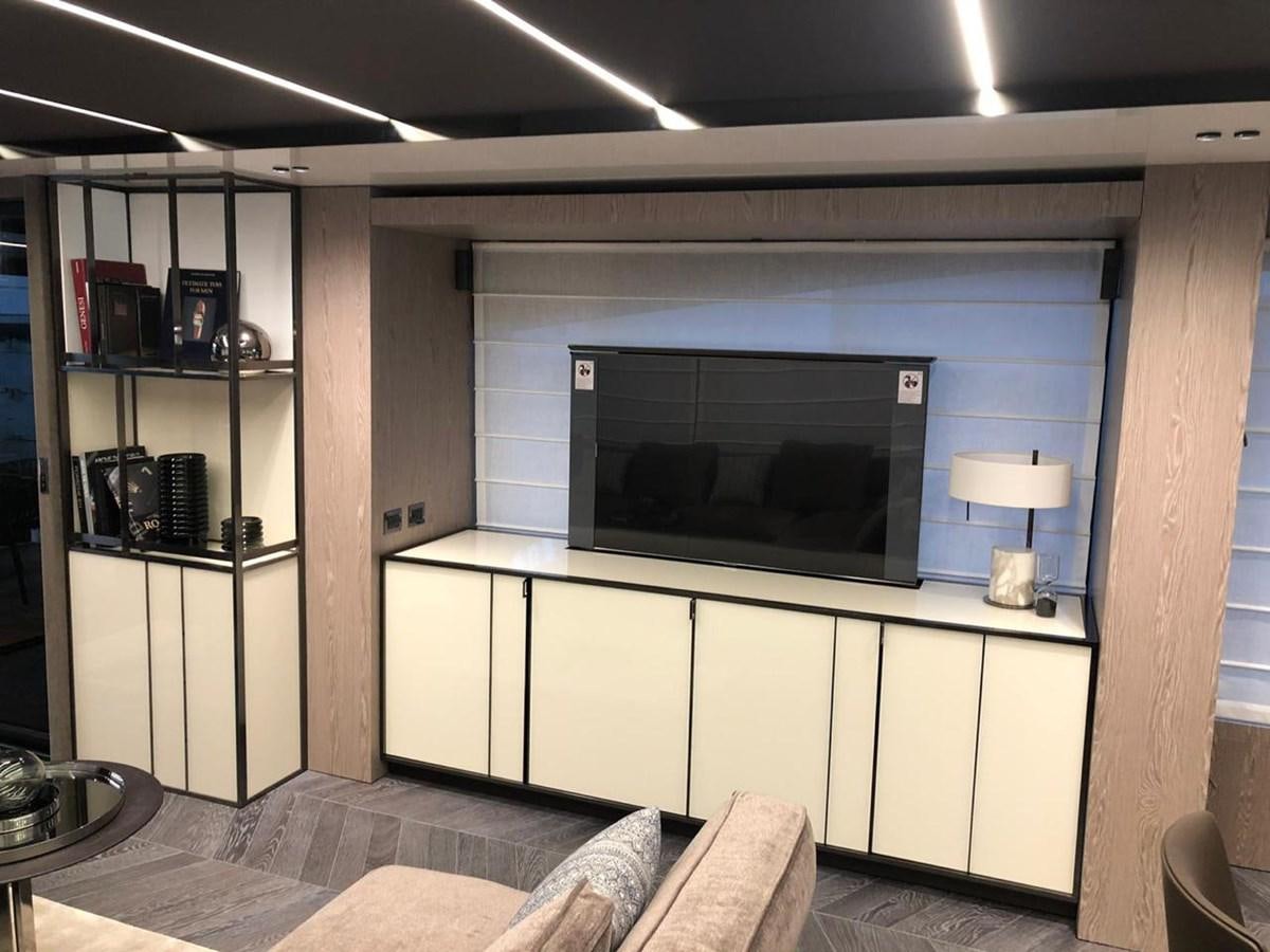 a room with a fireplace aboard SETTANTOTTO 78 Yacht for Sale