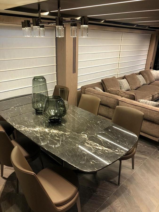 a table with glasses on it aboard SETTANTOTTO 78 Yacht for Sale