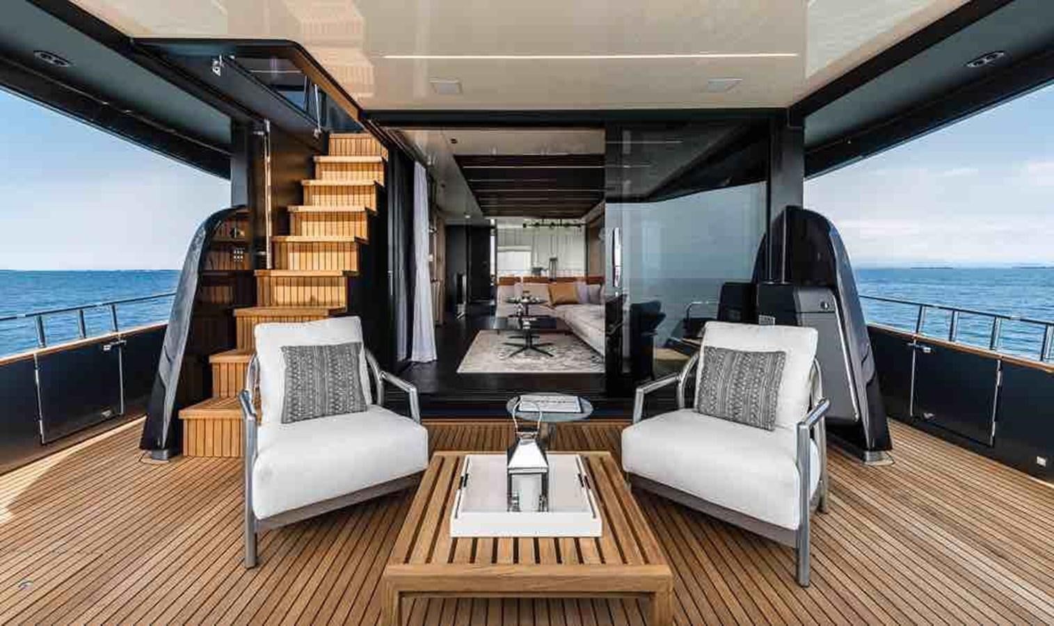 a room with a view of the ocean and the deck aboard SETTANTOTTO 78 Yacht for Sale