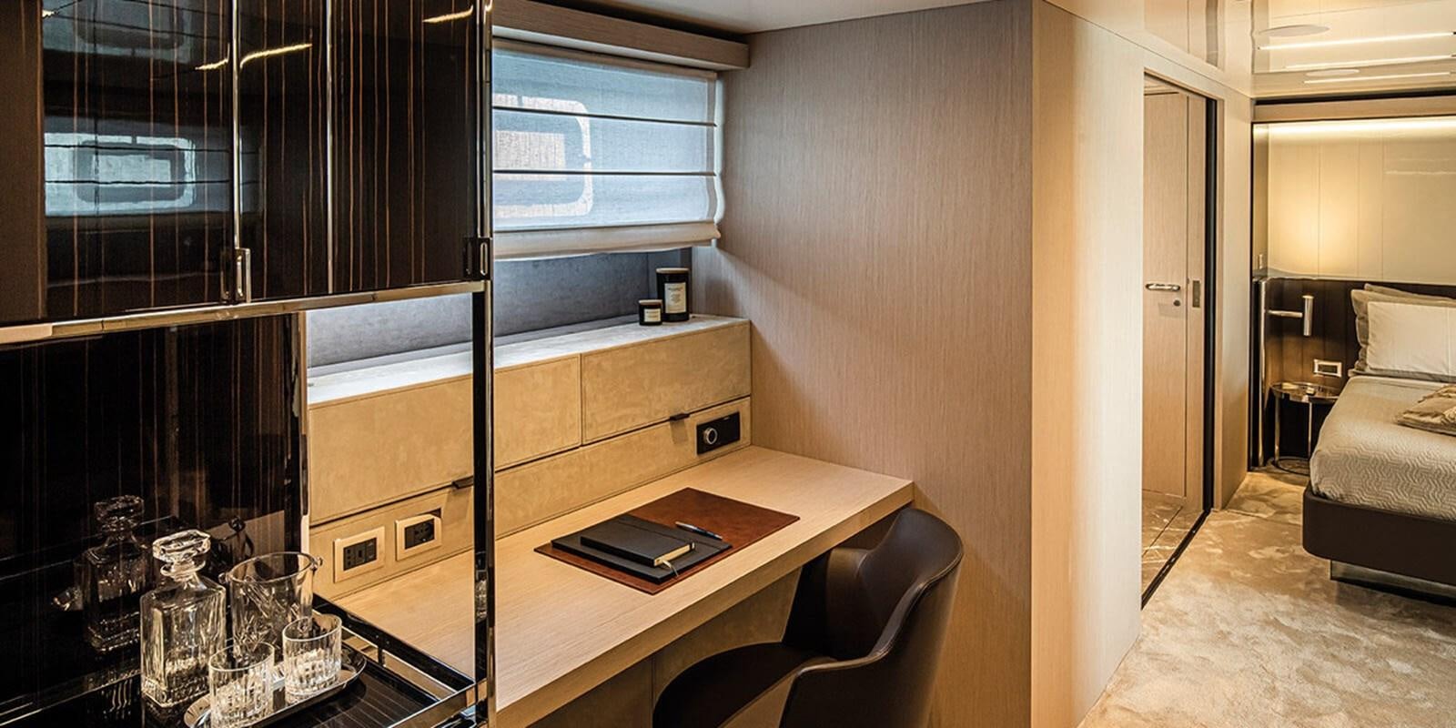 a room with a table and chairs aboard SESSANTASETTE 67 Yacht for Sale