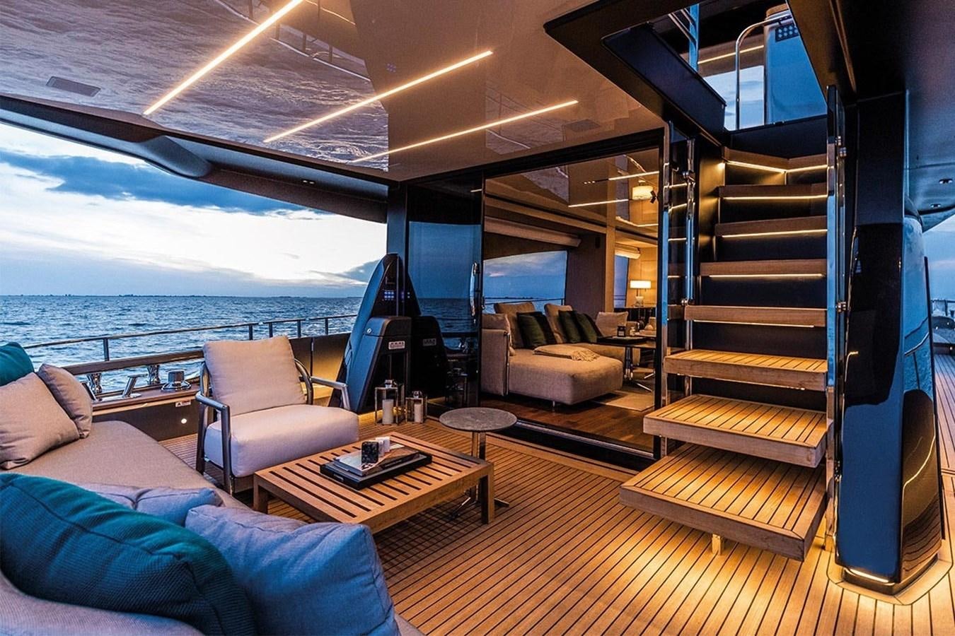a boat with a table and chairs aboard SESSANTASETTE 67 Yacht for Sale