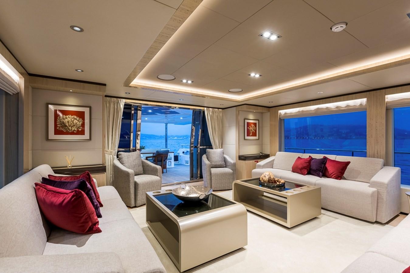 a living room with a large window aboard KRISHH Yacht for Sale
