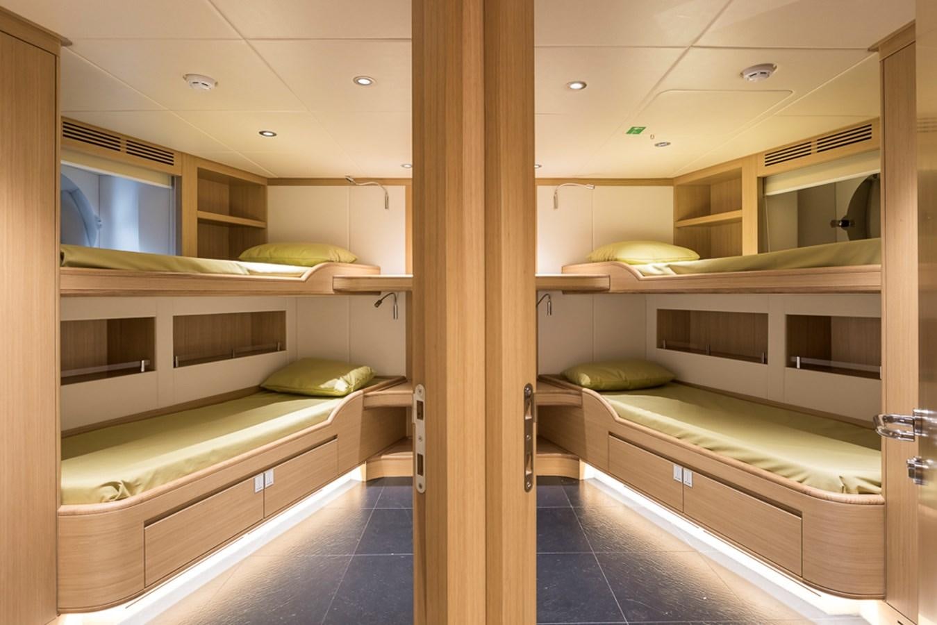 a room with bunk beds aboard KRISHH Yacht for Sale