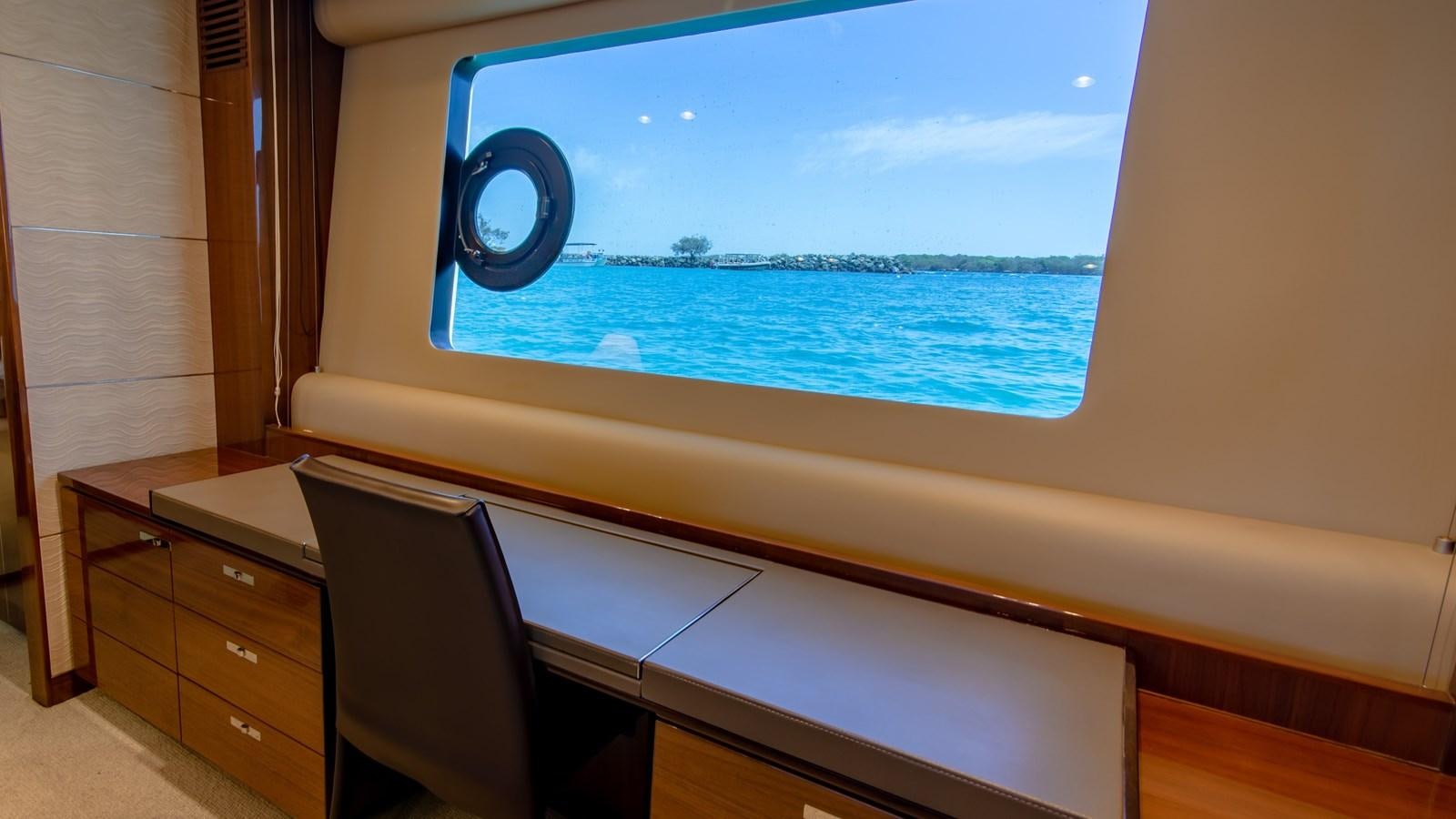 a window with a view of the ocean and the land below aboard SEA WOLF Yacht for Sale
