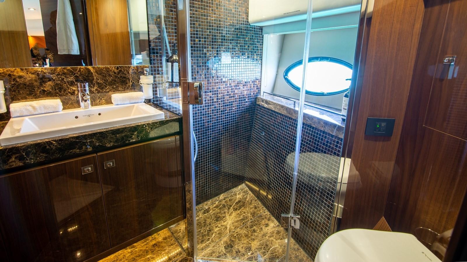 a bathroom with a sink and a shower aboard SEA WOLF Yacht for Sale