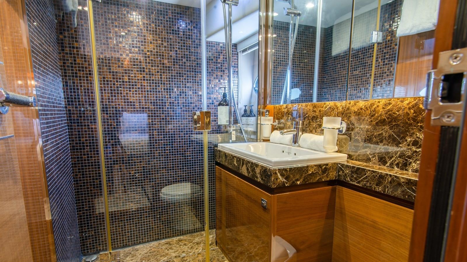 a bathroom with a sink and a shower aboard SEA WOLF Yacht for Sale