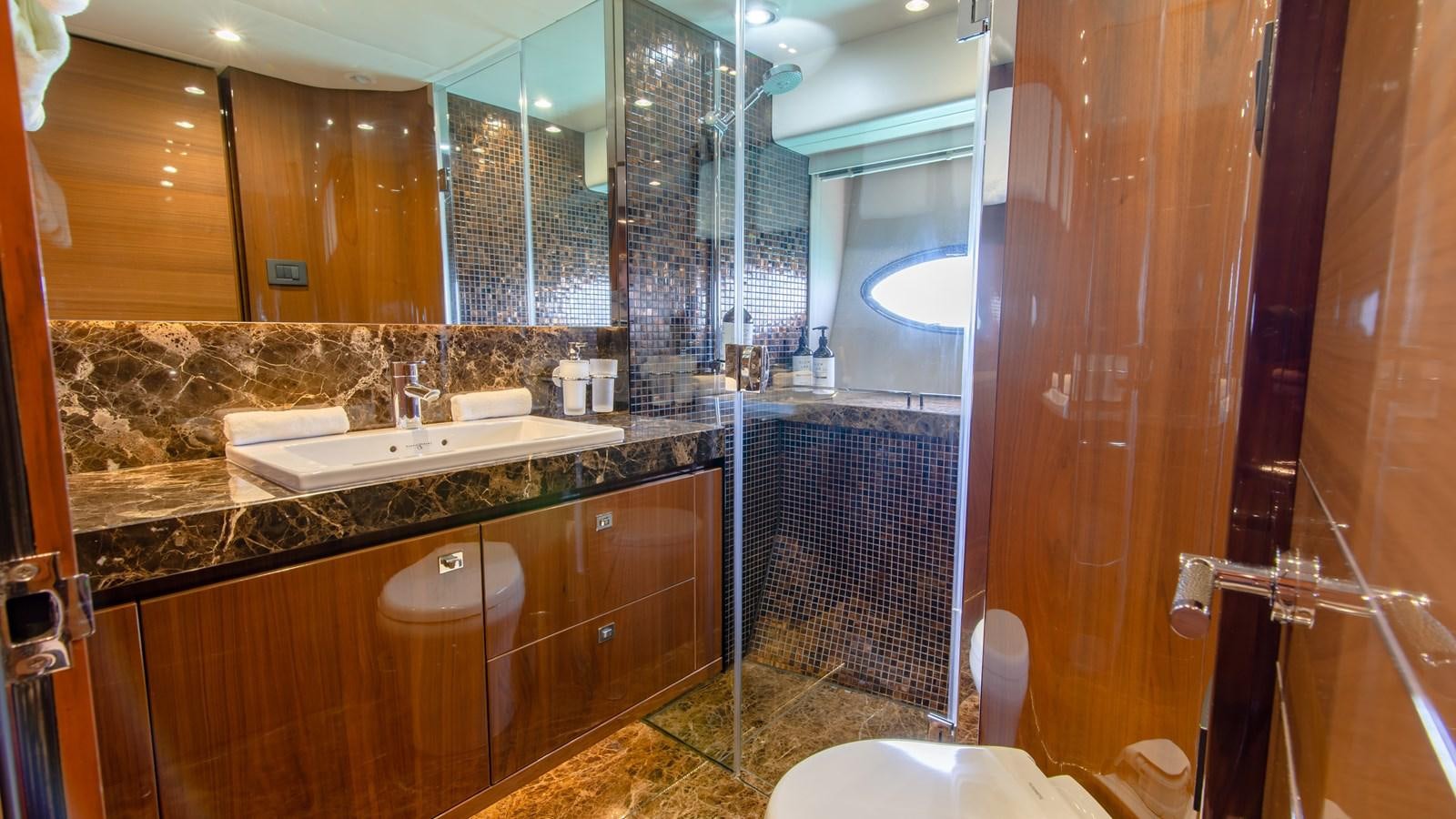 a bathroom with a large mirror aboard SEA WOLF Yacht for Sale