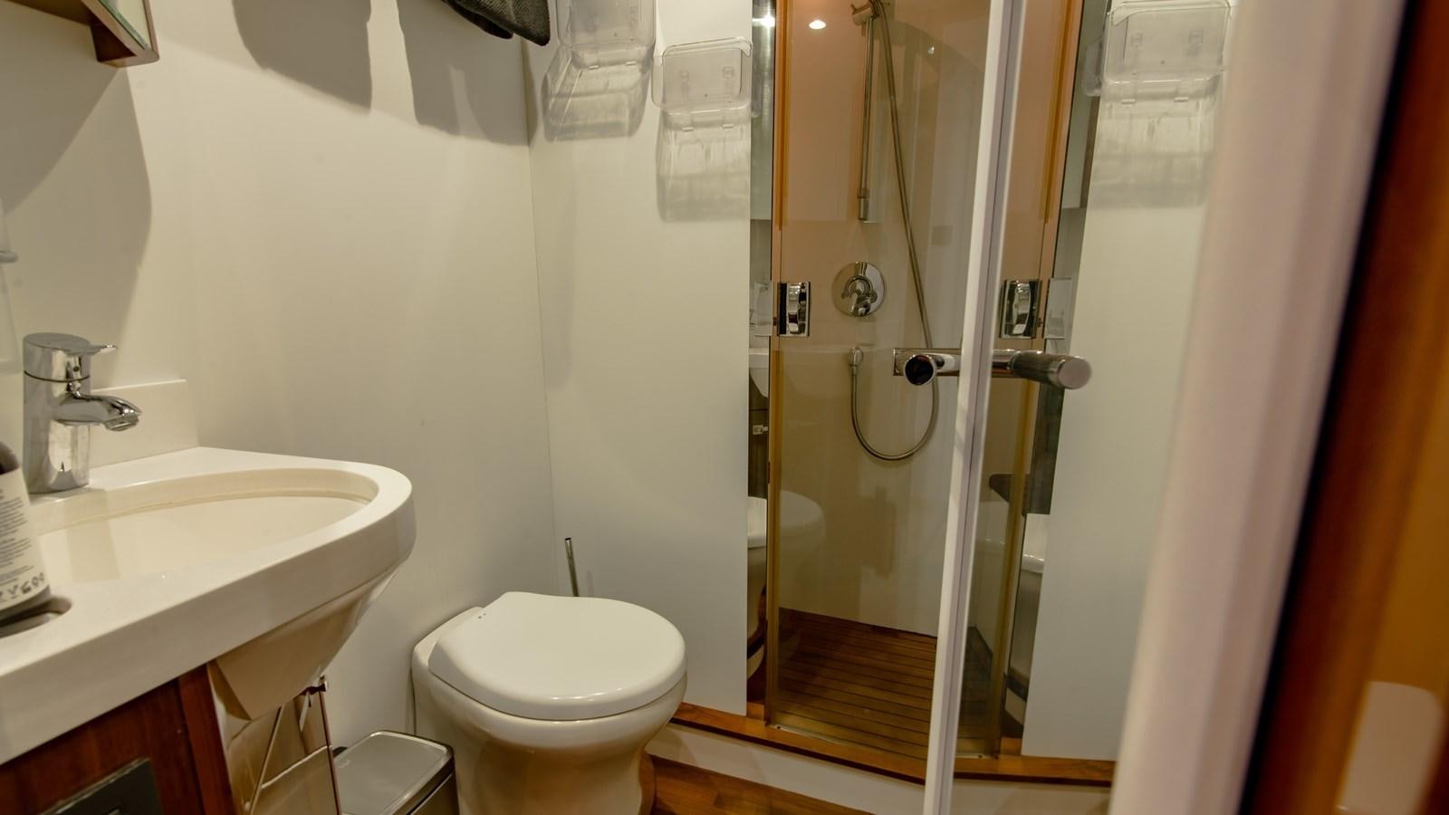 a bathroom with a glass shower door aboard SEA WOLF Yacht for Sale