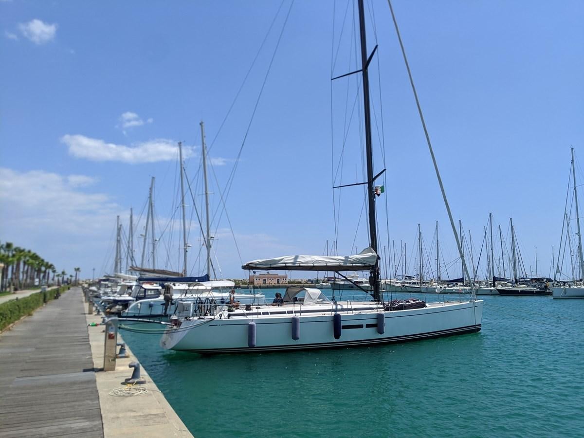 a boat docked at a pier aboard SALPARE Yacht for Sale