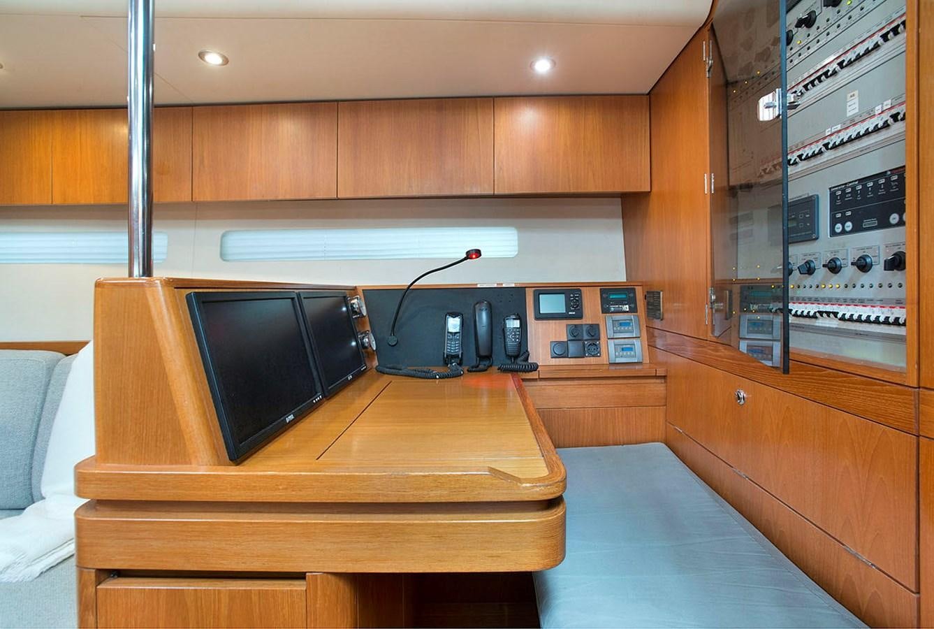 a room with a tv and electronics aboard SALPARE Yacht for Sale