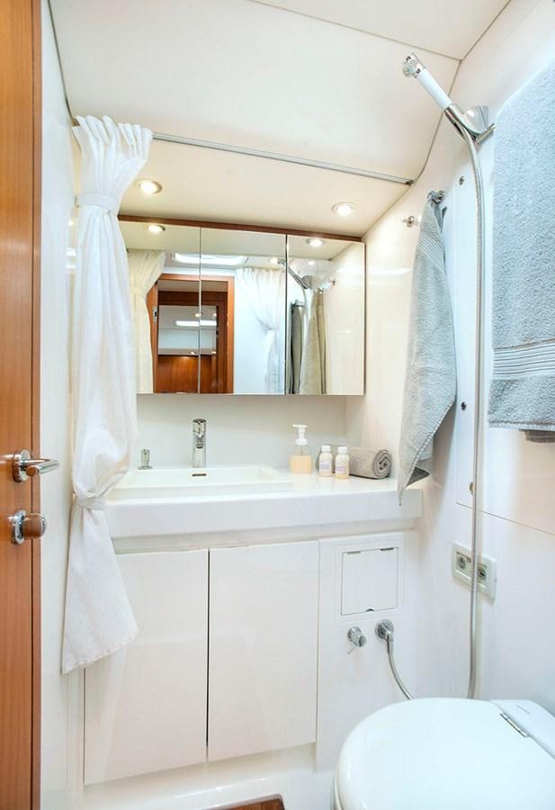 a bathroom with a sink and a mirror aboard SALPARE Yacht for Sale