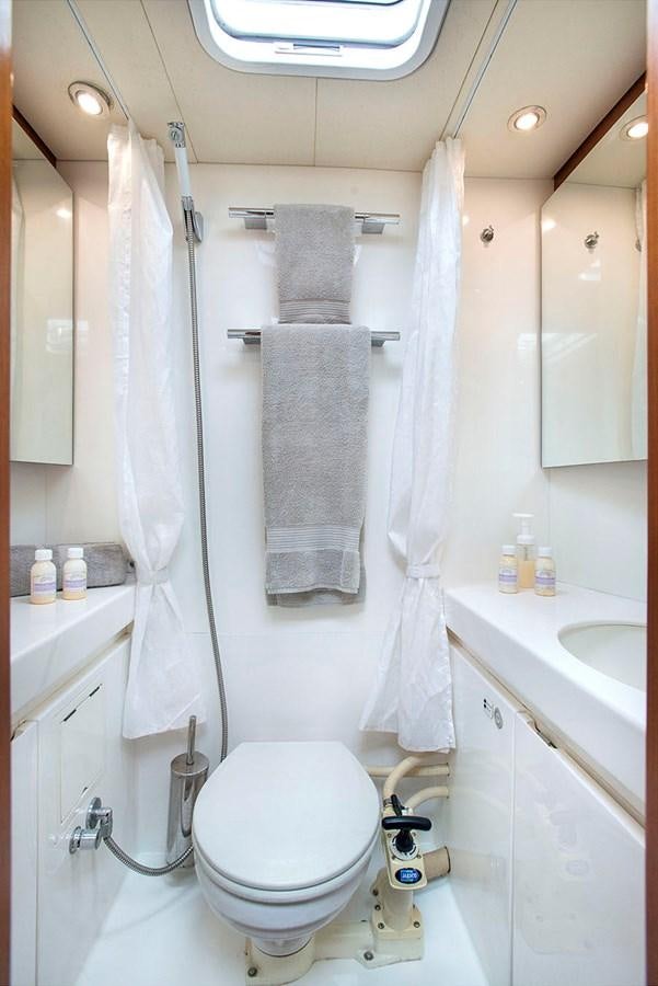 a bathroom with a towel on the wall aboard SALPARE Yacht for Sale