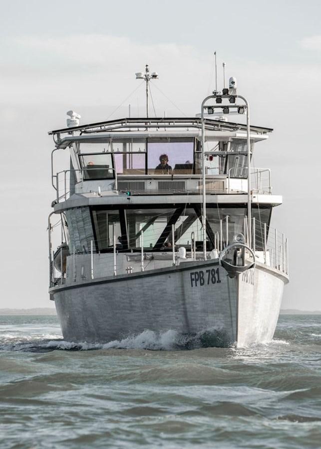 a large boat in the water aboard COCHISE Yacht for Sale