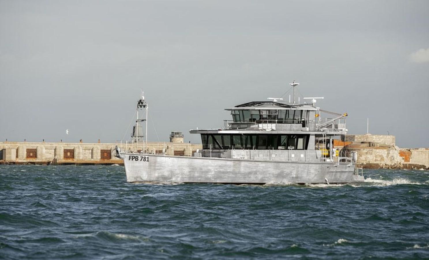 a large boat in the water aboard COCHISE Yacht for Sale