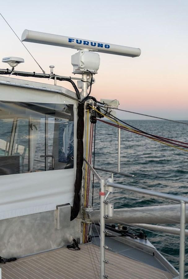 a boat with a satellite dish on the deck aboard COCHISE Yacht for Sale