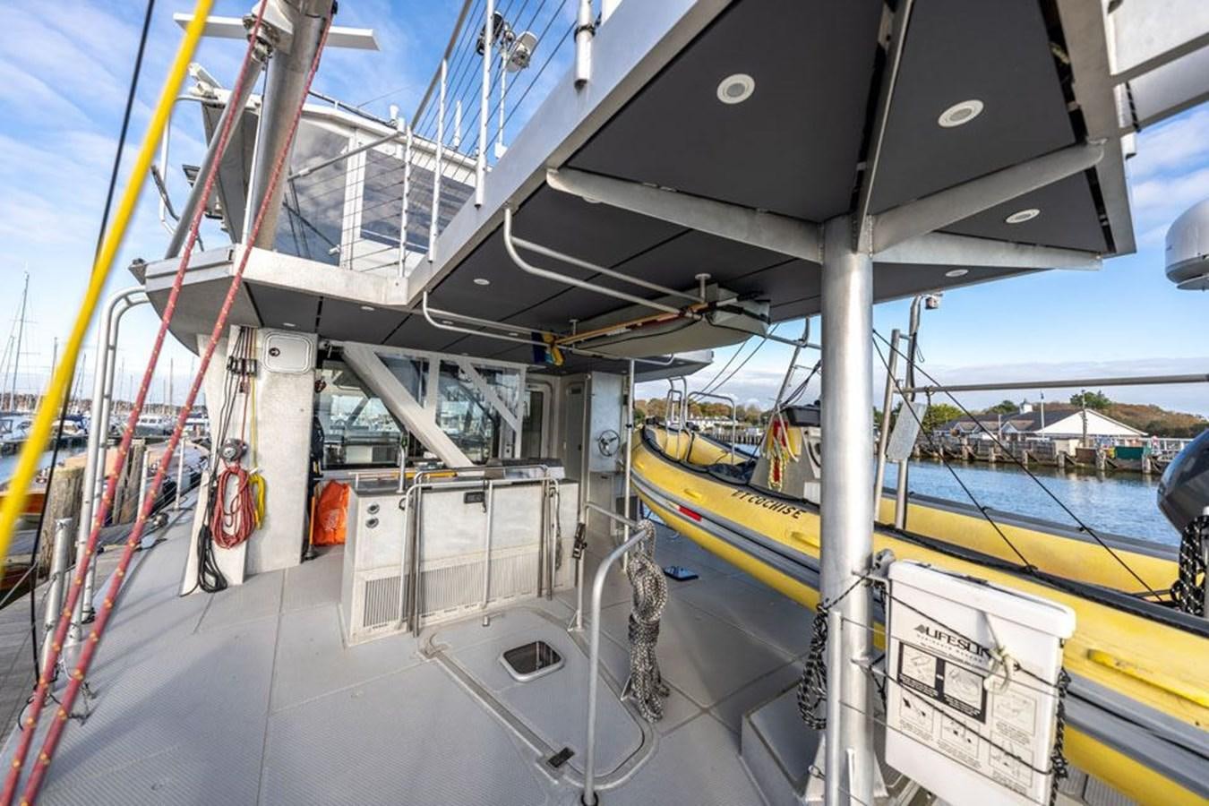 a large white and yellow ship aboard COCHISE Yacht for Sale