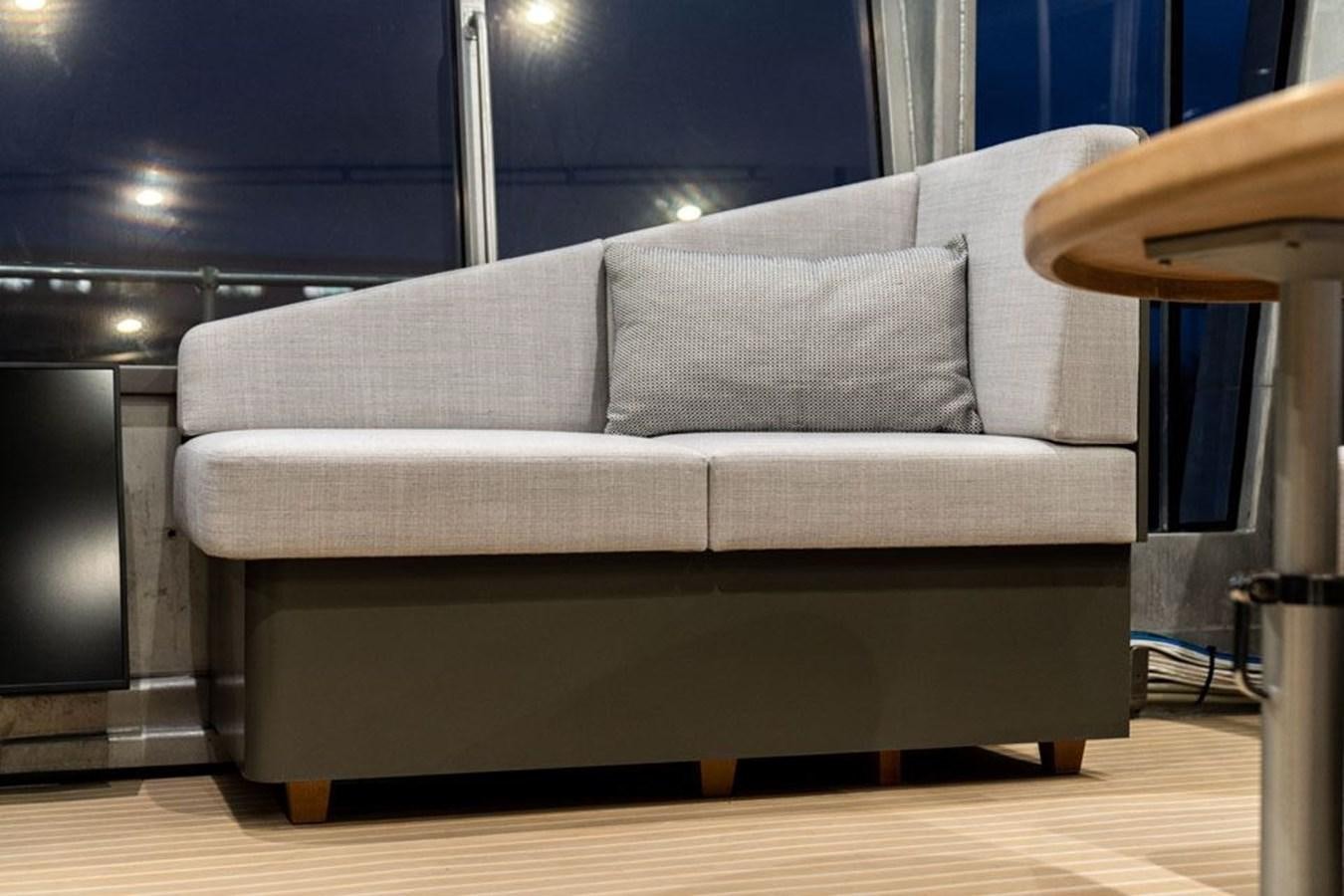 a couch in a room aboard COCHISE Yacht for Sale