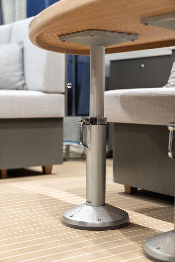 a table with a chair and a couch in the background aboard COCHISE Yacht for Sale