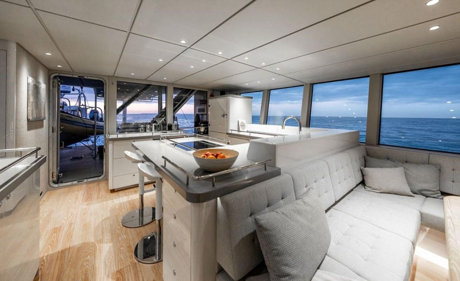 a room with a table and chairs aboard COCHISE Yacht for Sale
