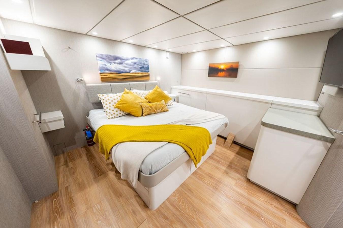 a bedroom with a bed aboard COCHISE Yacht for Sale