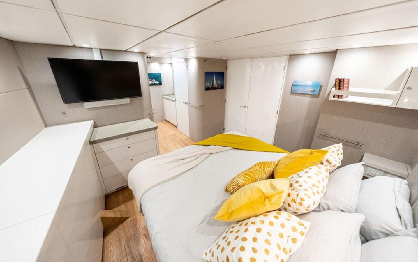a room with a couch and a television aboard COCHISE Yacht for Sale
