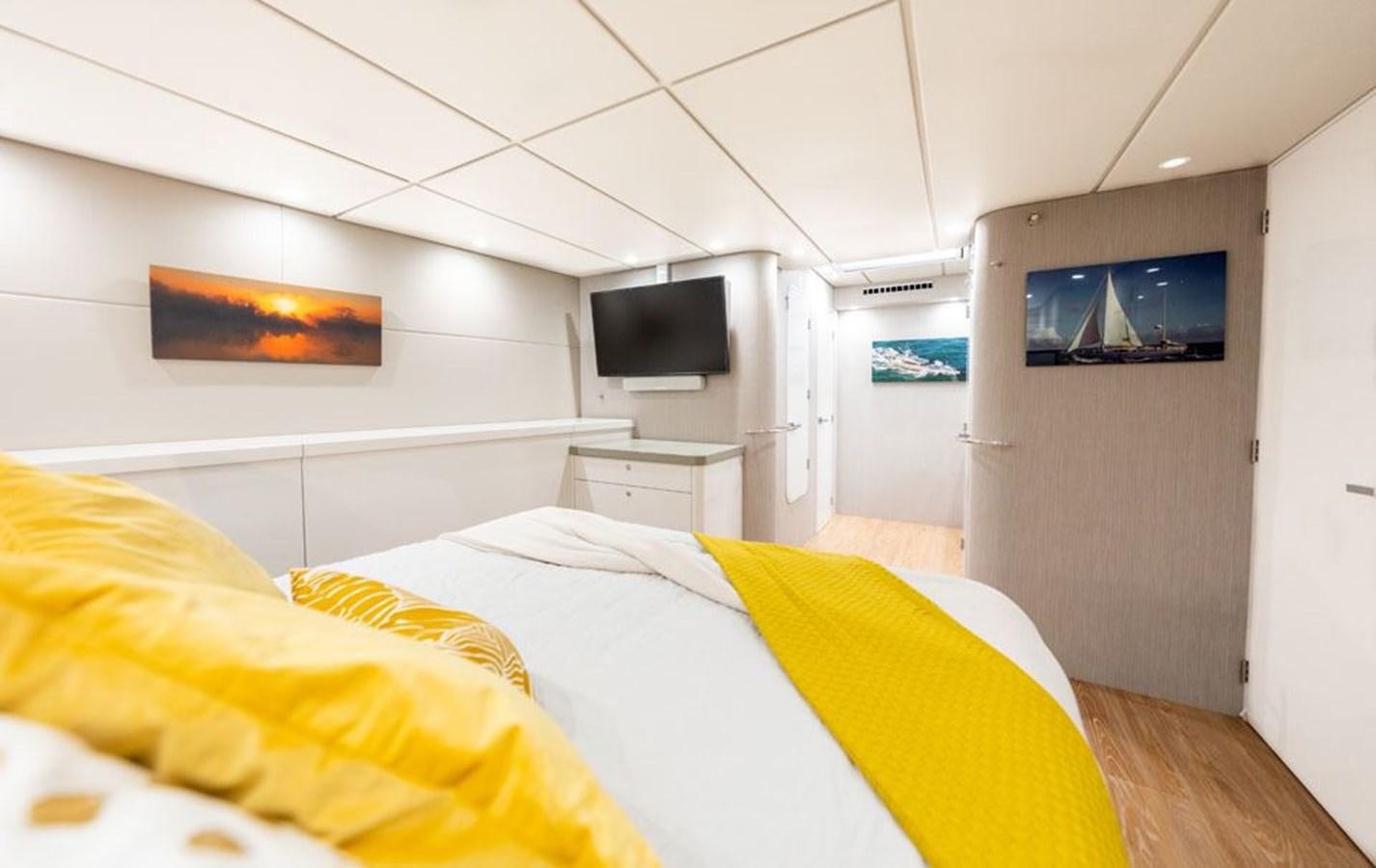 a room with a bed and a tv aboard COCHISE Yacht for Sale