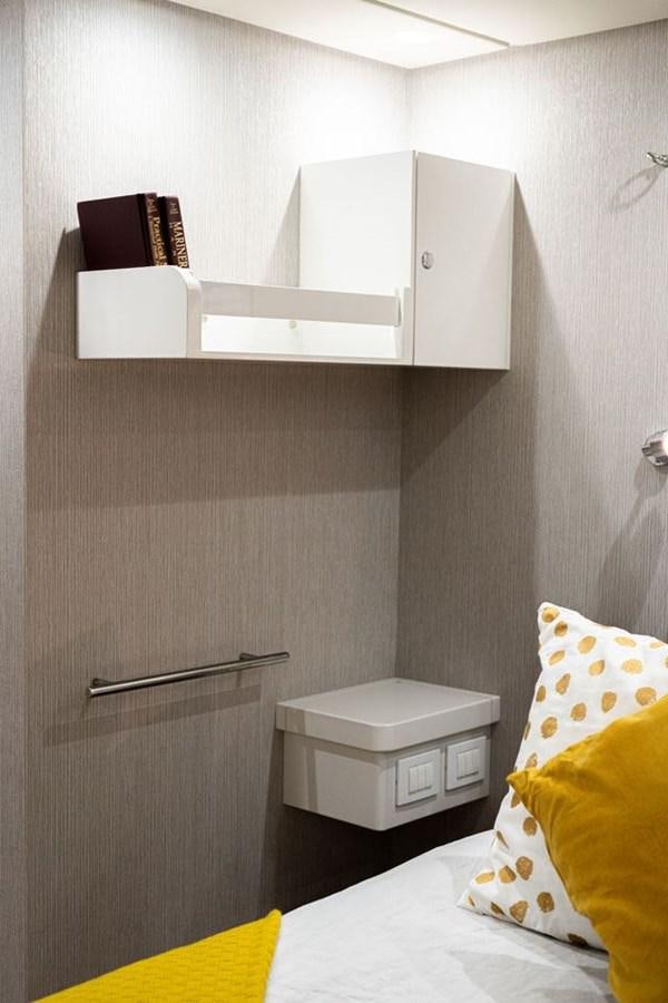 a white shelf above a bed aboard COCHISE Yacht for Sale