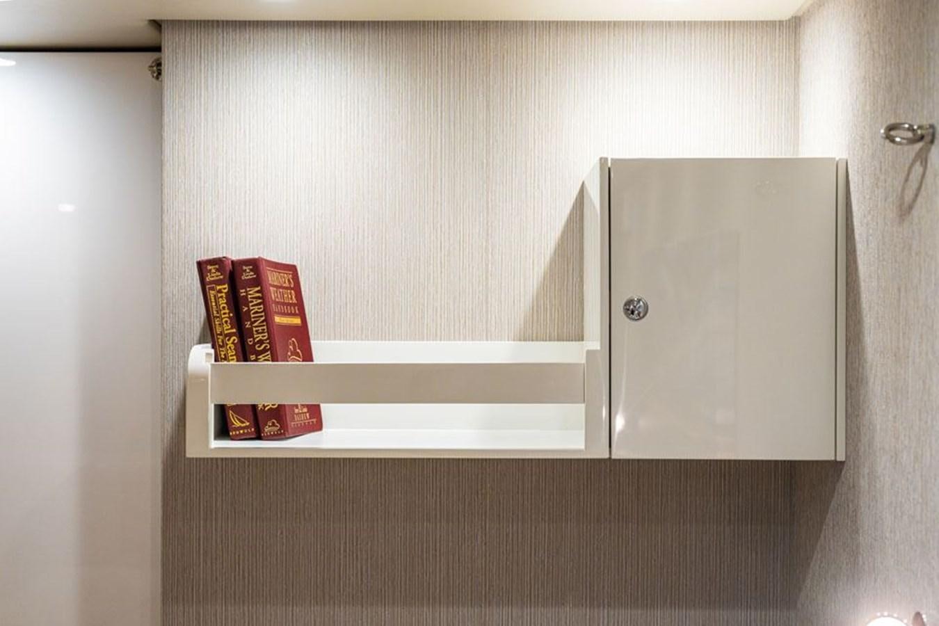 a white shelf with a red box on it aboard COCHISE Yacht for Sale