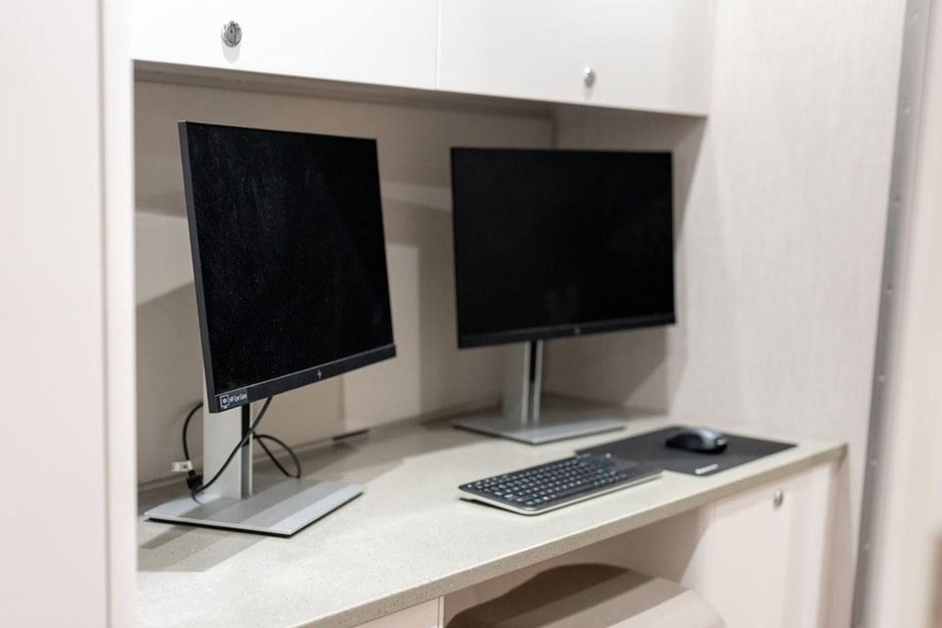 a computer on a desk aboard COCHISE Yacht for Sale