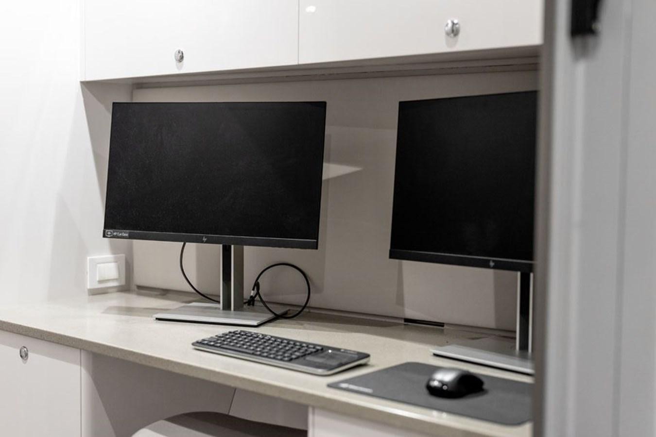 a computer on a desk aboard COCHISE Yacht for Sale