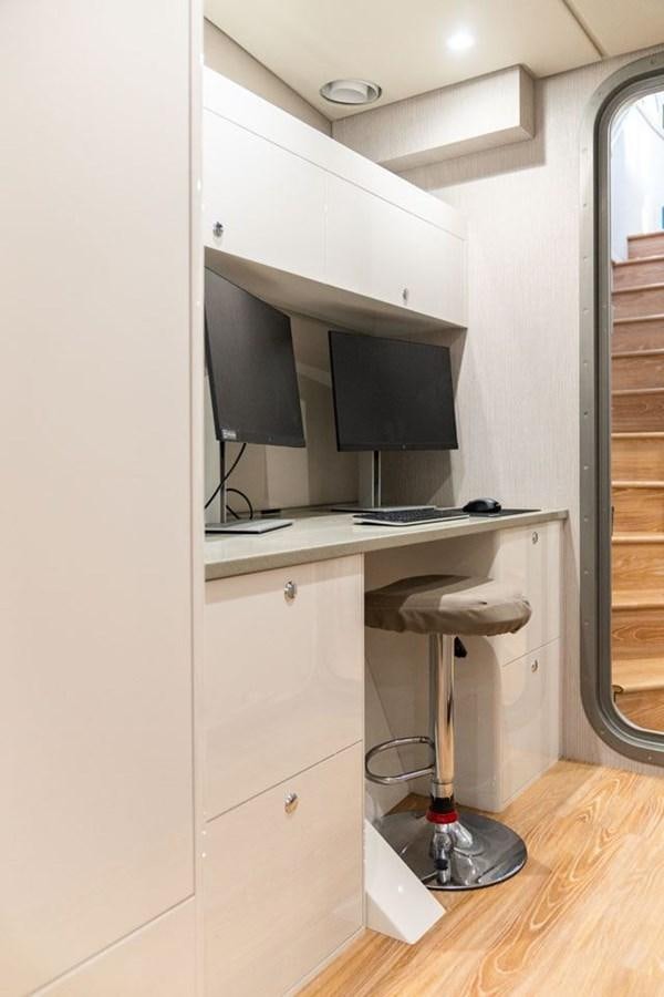 a white cabinet with a black television on it aboard COCHISE Yacht for Sale