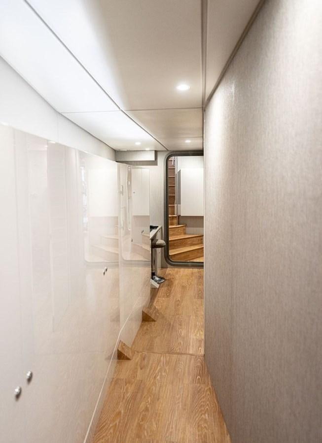 a hallway with white doors aboard COCHISE Yacht for Sale